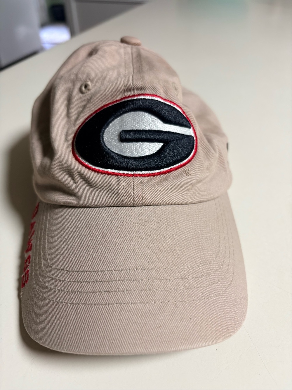 Russell Athletic beige and black cap with logo tag